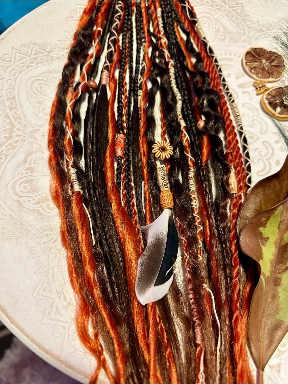 Blonde Hair Extensions with Black and Orange Braided Accents